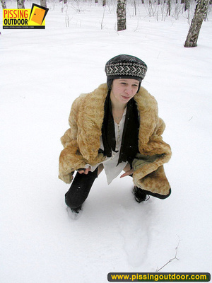 Cute white teen in fur coat, shirt and pantyhose takes an piss in the snow - Picture 4
