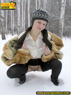 Cute white teen in fur coat, shirt and pantyhose takes an piss in the snow - Picture 12