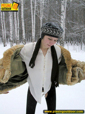 Cute white teen in fur coat, shirt and pantyhose takes an piss in the snow - Picture 16