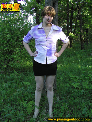 Nature lover takes off panties and raises short skirts to piss in the woods - XXXonXXX - Pic 1