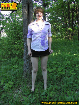Nature lover takes off panties and raises short skirts to piss in the woods - Picture 3