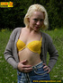 Hot blonde strips off her clothes erotically before letting out a spray