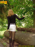 Sweetly dressed chick in high black boots and short white skirt pissing