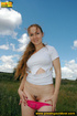 Hot chick strips jeans to show sweet pink panties as she steps on rock