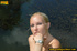 Sexy blonde with hot booty climbs concrete ledge to piss into the river