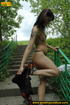 Naughty teen babe in the park rains down piss on the park ladder