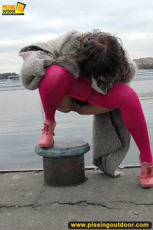 Babe walking outdoors makes a quick stop on an embankment to let out hot piss - XXXonXXX - Pic 12