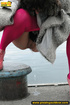 Babe walking outdoors makes a quick stop on an embankment to let out hot