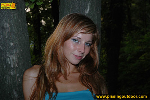 Redhead in blue raises her top and skirt to expose tits and piss outdoors at night - XXXonXXX - Pic 16