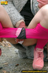 Girl in bright shows no shame as she bends to show pussy and pee right