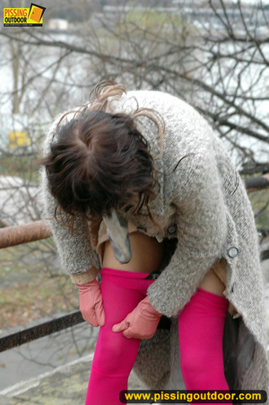 Girl in bright shows no shame as she bends to show pussy and pee right on the road - Picture 15