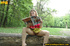 Cute chick sits on tree log in the woods and spreads legs to piss on magazine