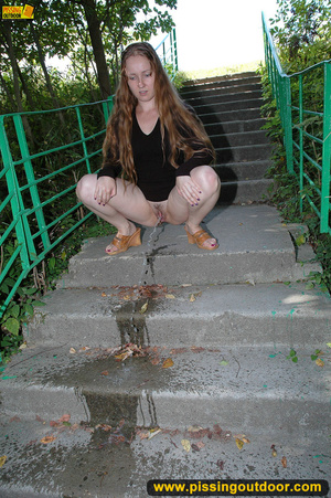 Smiling cute shapely chick in sexy black dress pisses along the park steps - XXXonXXX - Pic 10