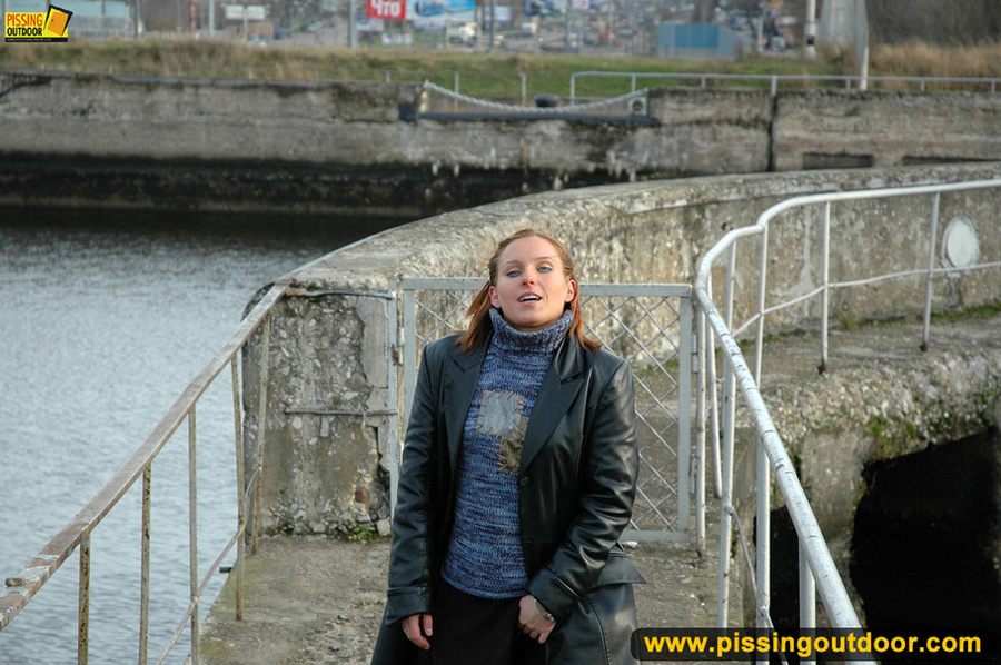 Girl in leather and stockings taking a stroll stops to piss outdoors in public - XXXonXXX - Pic 2