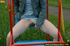 Hot young chick in public playground raise skirt and slide panty to piss
