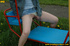 Hot young chick in public playground raise skirt and slide panty to piss