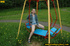 Hot young chick in public playground raise skirt and slide panty to piss