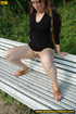 Cute naughty chick on a stroll stops to bend on park bench and spray piss