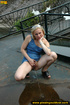 Young blonde chick with small sexy tiny tits bends to open ass and piss