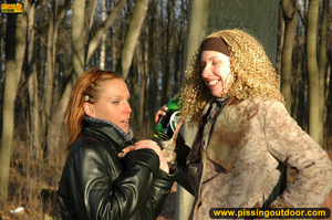 Two very sexy girlfriends taking a walk outdoors stop to piss by large stone - XXXonXXX - Pic 2
