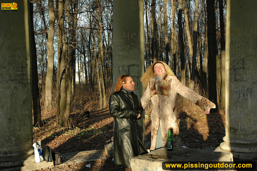 Two very sexy girlfriends taking a walk outdoors stop to piss by large stone - XXXonXXX - Pic 3