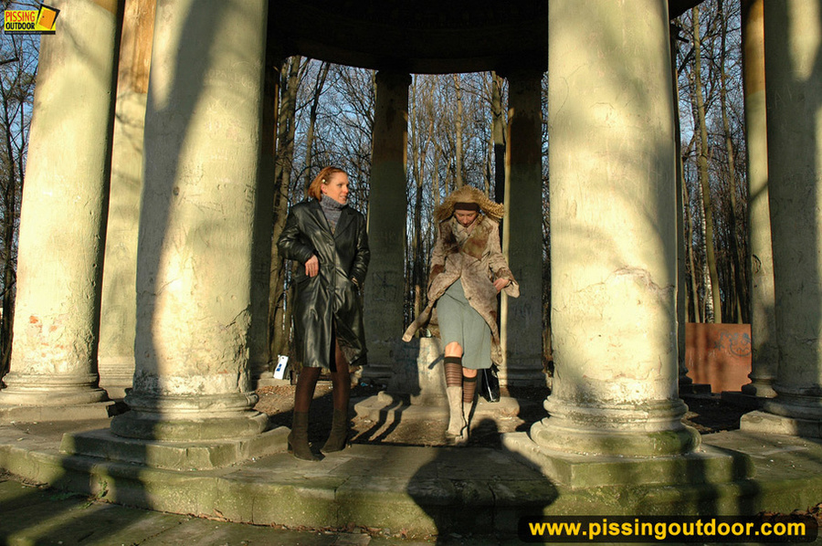 Two very sexy girlfriends taking a walk outdoors stop to piss by large stone - XXXonXXX - Pic 5