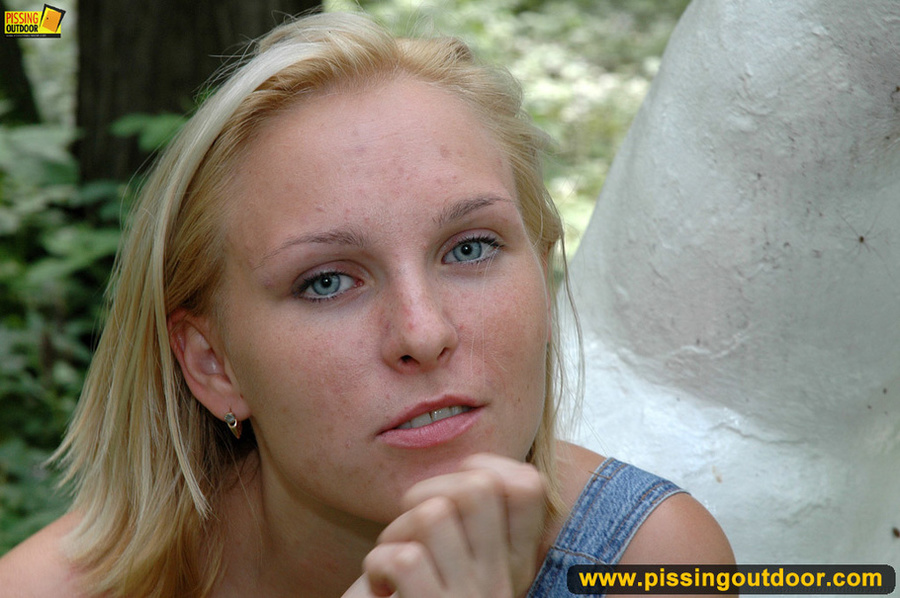 Hot blonde in cute short dress taking a walk stops to piss by a public statute - XXXonXXX - Pic 17