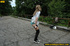 Smiling babe strips of stockings and shoes to pee hot piss on public concrete