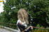 Smiling babe strips of stockings and shoes to pee hot piss on public concrete