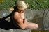 Sexy blonde with seductive body takes off clothes and sprays piss outdoors