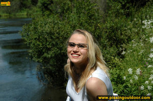 Hot blonde on nature stroll takes hot piss on stone ledge to river below - XXXonXXX - Pic 17