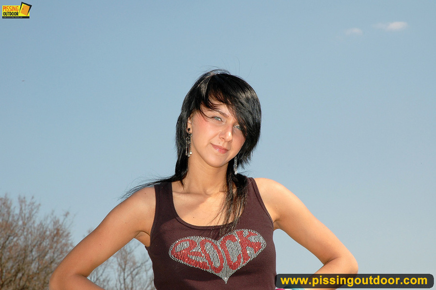 Horny and sexy young chick drops down jeans and bends down to spray hot piss - XXXonXXX - Pic 1