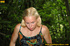 Horny blonde in cute short skirt takes walk in woods and pisses on tree