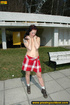 Hot young chick sprays hot piss in concrete driveway in front of house