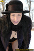 Lady in black coat and hat expose seductive ass and sprays hot pee on
