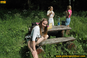 Very cute and young chick out in the woods enjoys pissing out in the woods - XXXonXXX - Pic 14