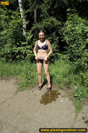 Lady in bikini removes panty along walkway in forest to piss in public - Picture 16
