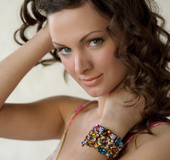 Passionate looking sweet chick stuns as she poses showing hot boobs and