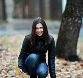 Skinny brunette teen with a plait undresses to expose her hairy snatch