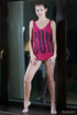 Skinny brunette teen with a plait undresses to expose her hairy snatch