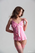 Hot brunette vixen takes off her pink baby-doll to rub her slit in stockings