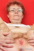 Red hair granny shows tits and hairy pussy before masturbating with long