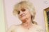 Naughty blonde grandma shows tits and pussy and plays with real big dildo