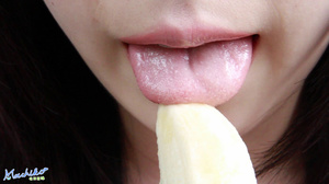 Young naughty hot Asian teen models her sexy body as she seductively eats banana - Picture 9