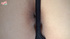 Smiling chick on bed shows off her sexy tiny thong that exposes her swollen