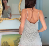 Blue eyed model enjoys herself nude in the livingroom mirror