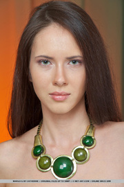 Beautiful young hottie leaves her green necklace on