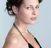 Lovely brunette strips her sexy black dress