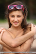 Pretty young hipster gets her naked body all sandy