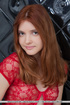 artsy young redhead struts